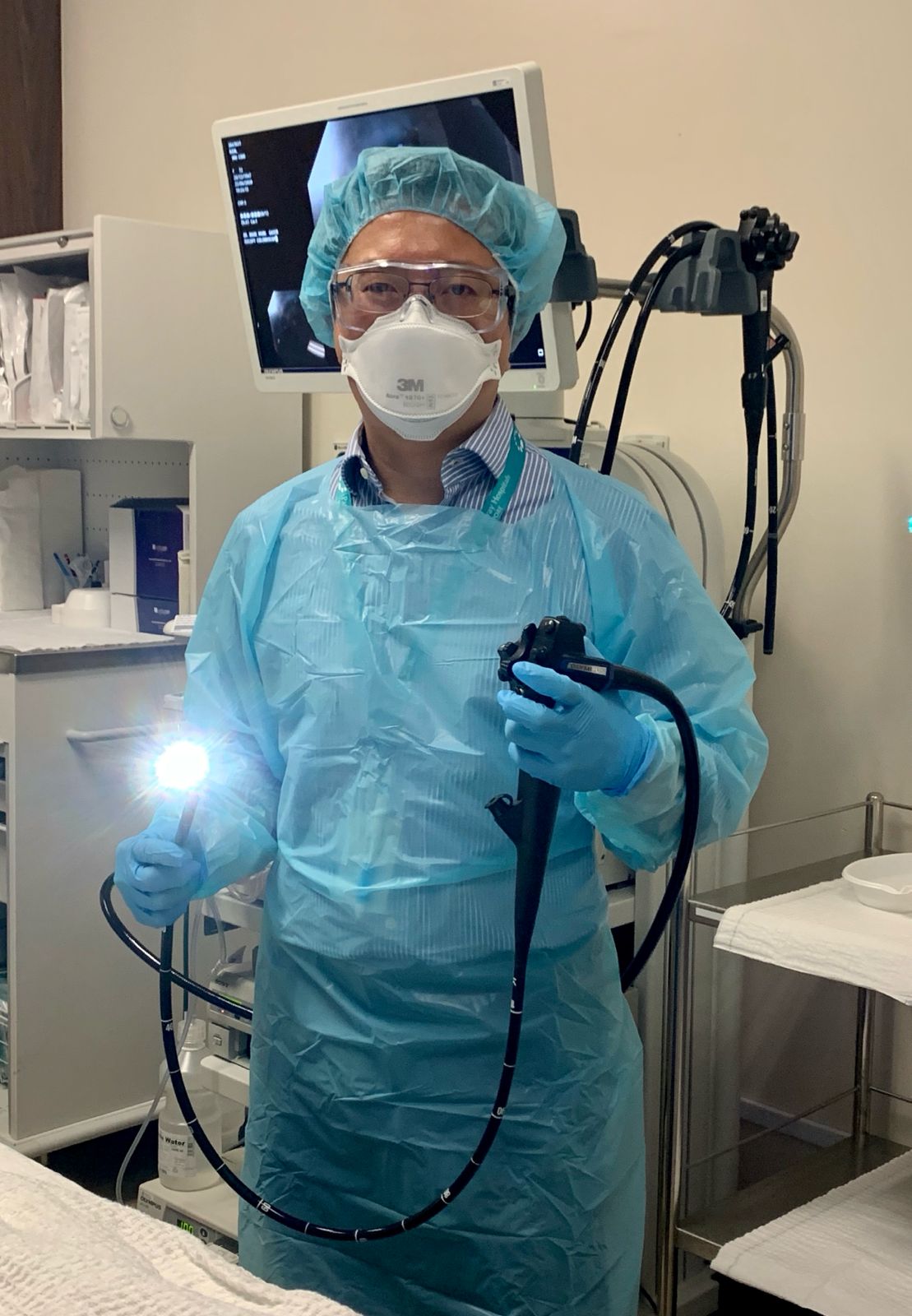 Dr Mark Wong prepares for a colonoscopy procedure to screen for and prevent colorectal cancer.